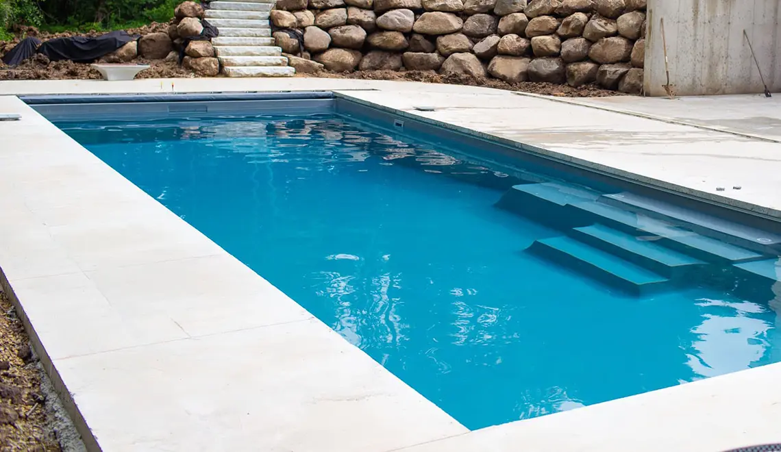 Leisure Pools The Grand rectangular fiberglass pool side view by Leisure Pools Durham